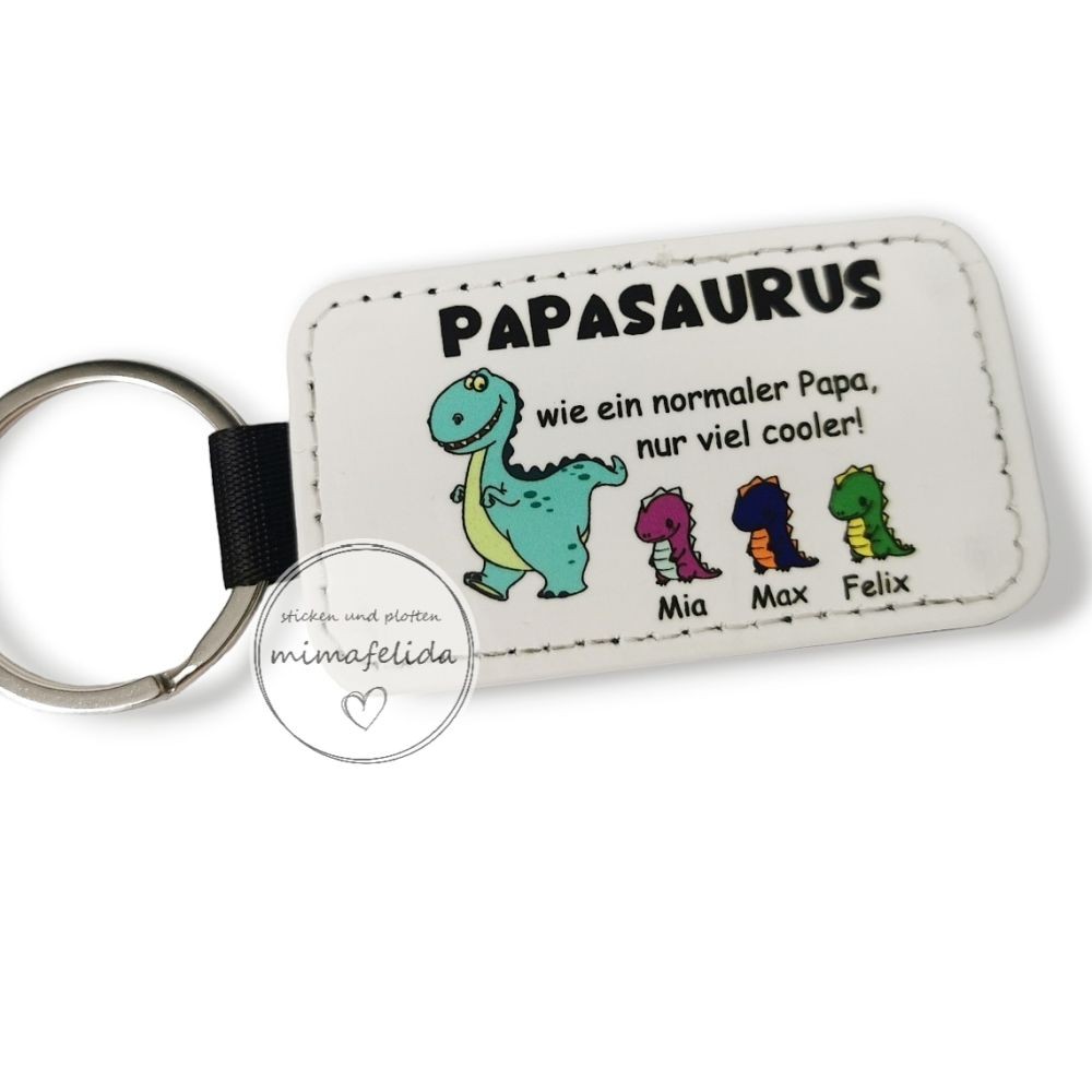 Schlüsselanhänger mit einem Dino Papa mit seinen Kindern mit Namen personalisiert